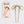 A Kit-Sch metal bow French hair pin shown next to its light pink retail packaging card on a light gray background.